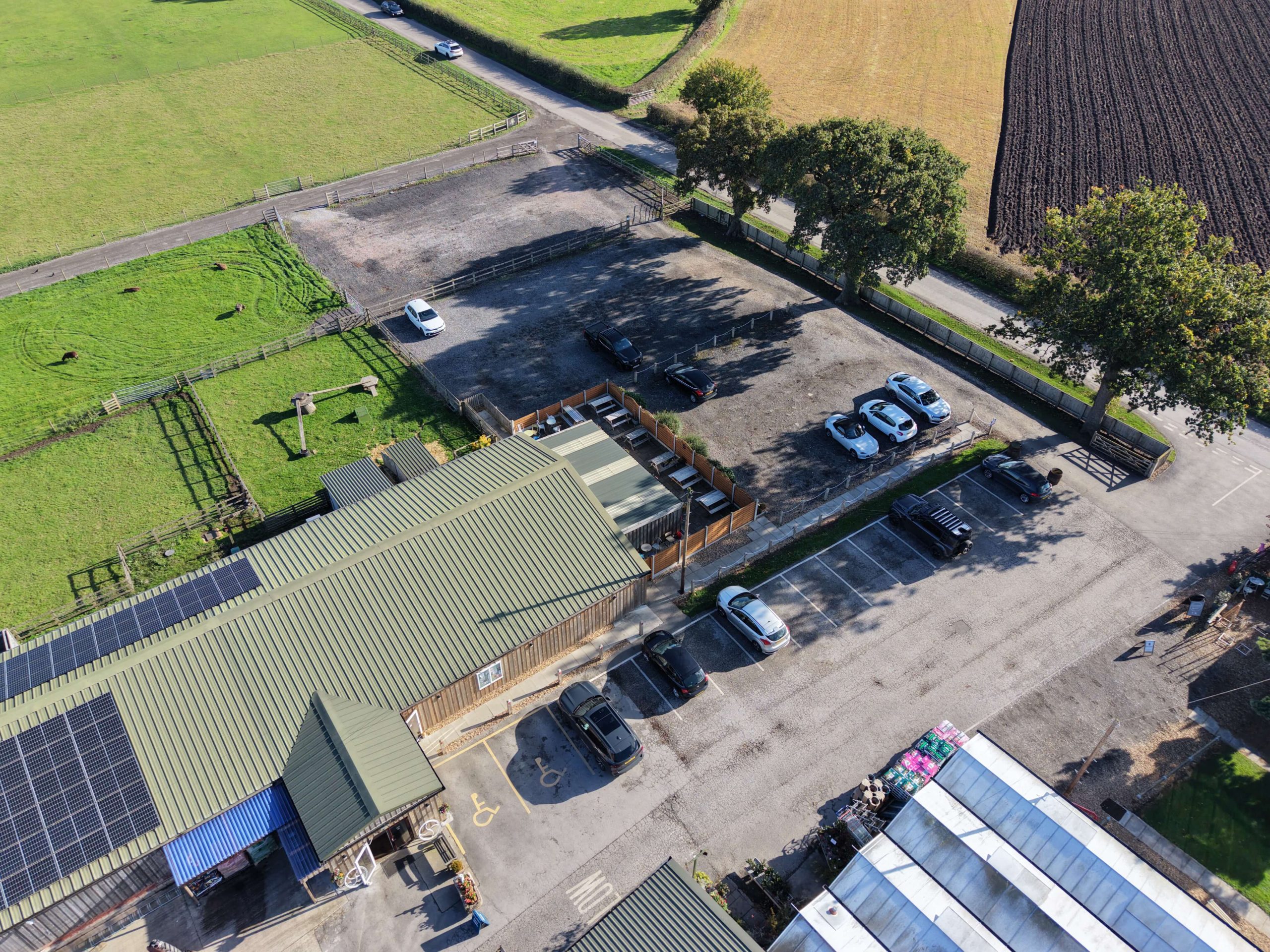 Aerial view of Lowe’s Farm Shop and car park in Byley, Cheshire